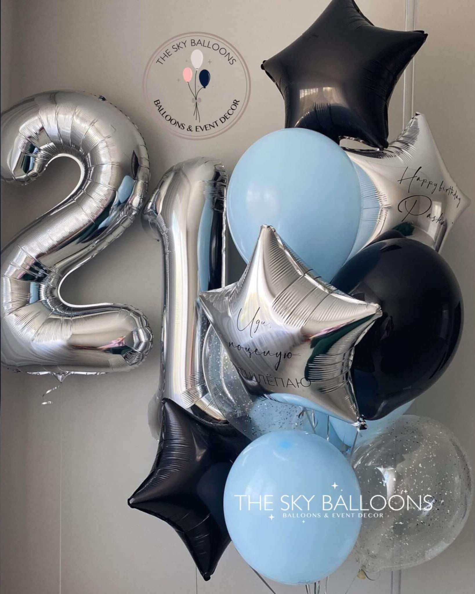 A festive balloon bouquet with a black and blue color scheme, featuring a number 21. Celebrate in style!