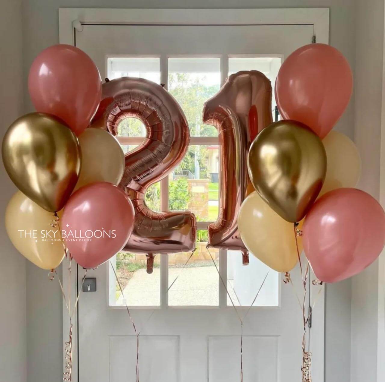 Balloons with number '21' in front of a door