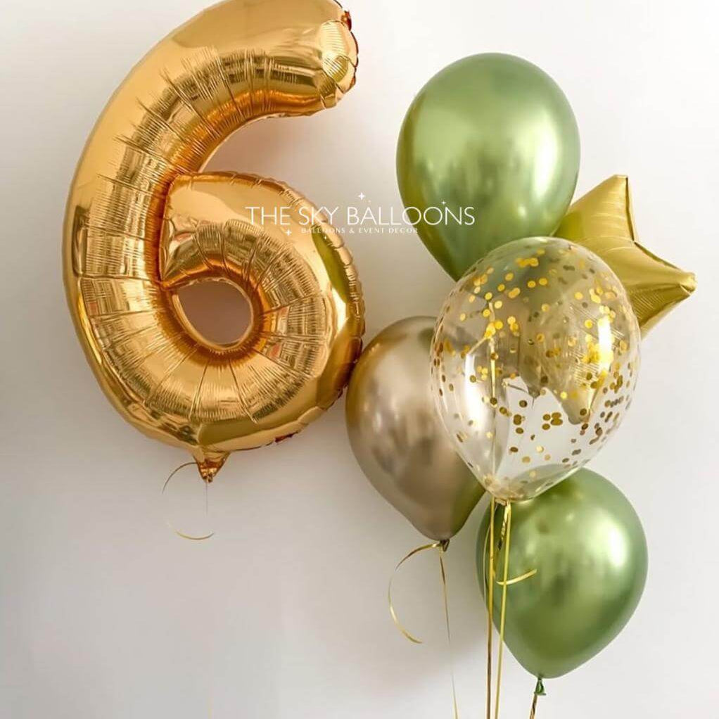 Gold number 6 balloon, green and gold balloons on a white background