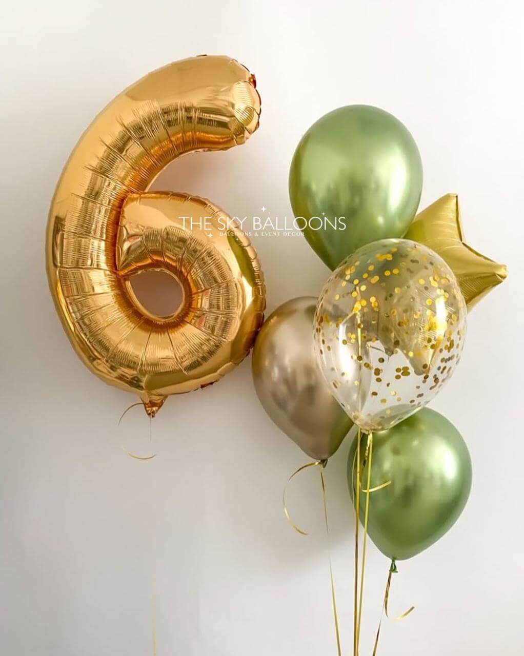 Gold number 6 balloon, green and gold balloons on a white background
