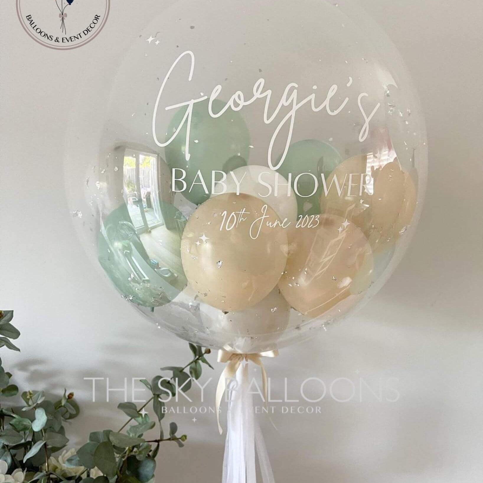 A personalized clear bubble balloon with a tassel, perfect for adding a touch of uniqueness to any celebration.