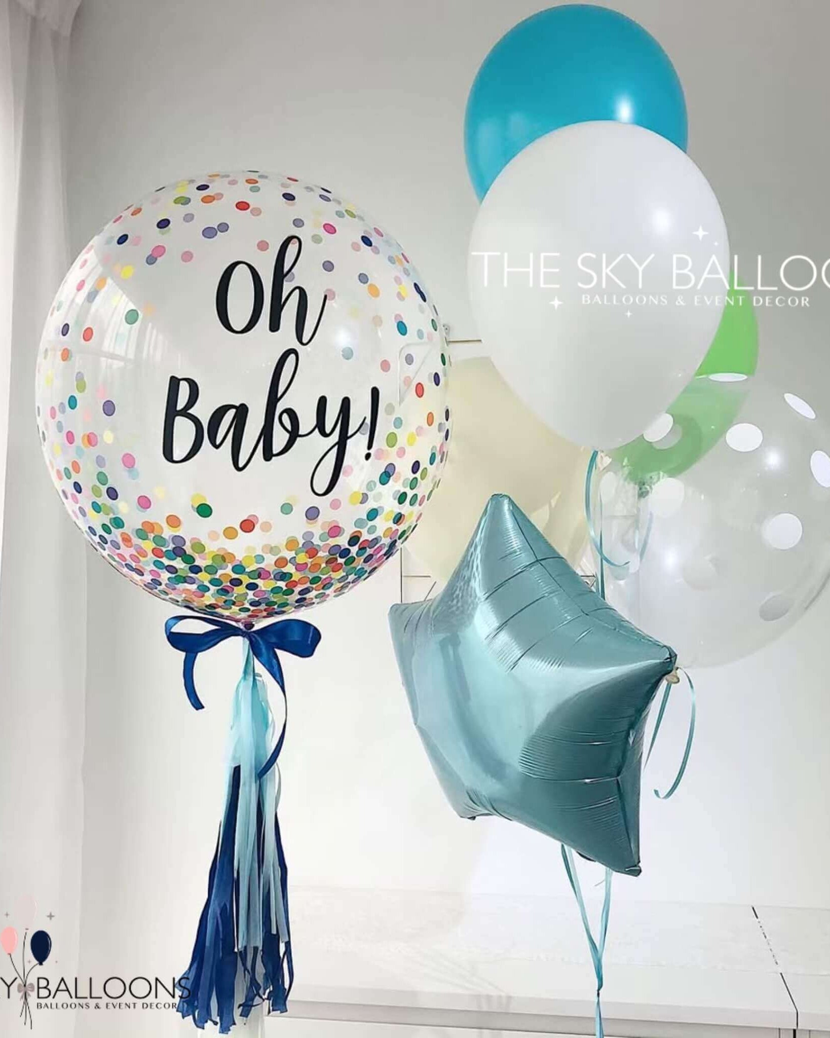 A vibrant assortment of balloons with "Oh Baby" written on them, ideal for welcoming a new arrival.