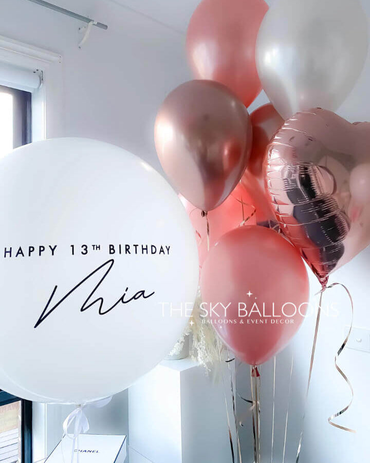 Elegant Rose Gold Personalized Bubble Balloon with customizable text, featuring transparent outer layer and metallic rose gold confetti