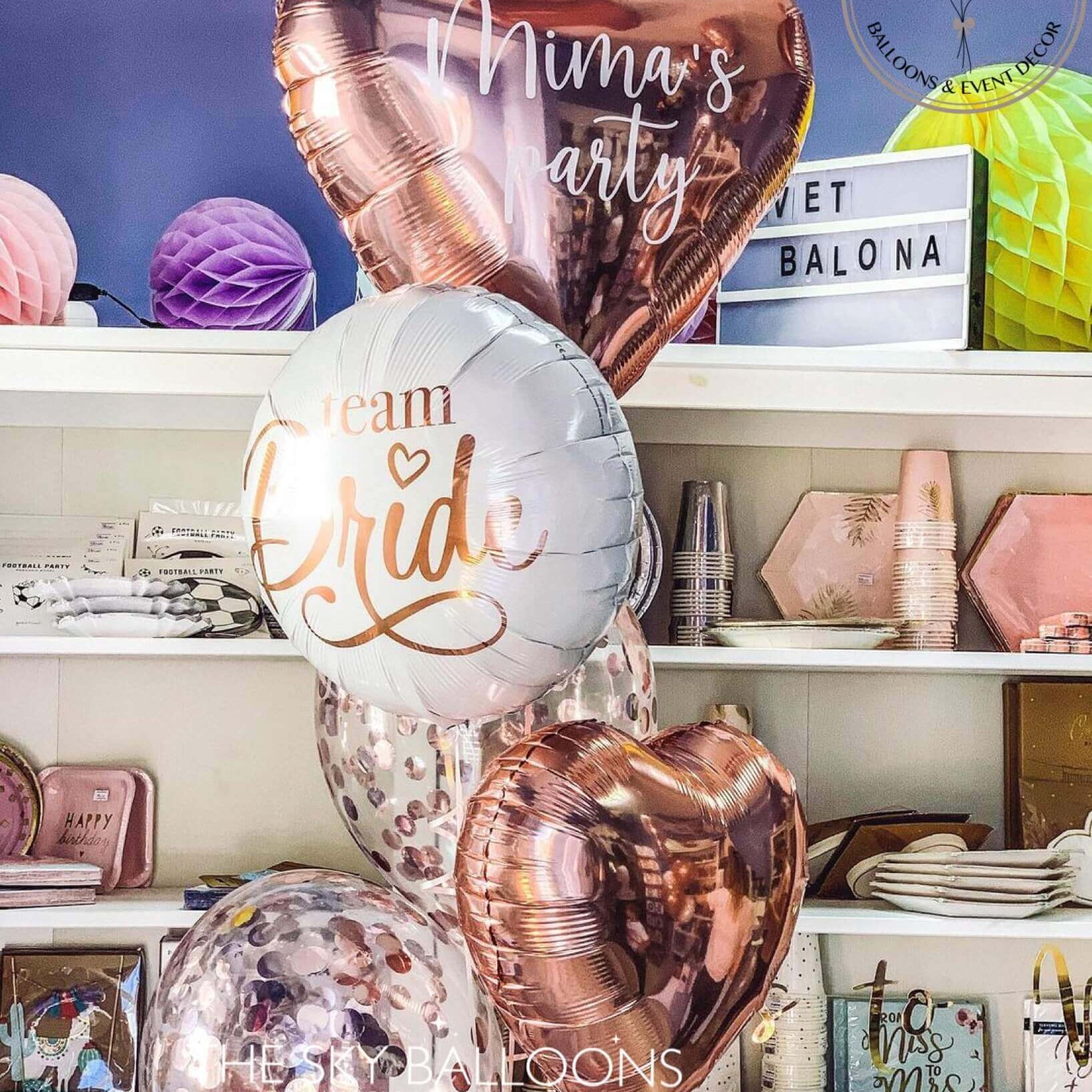 A colorful assortment of balloons and various items on display in a store.