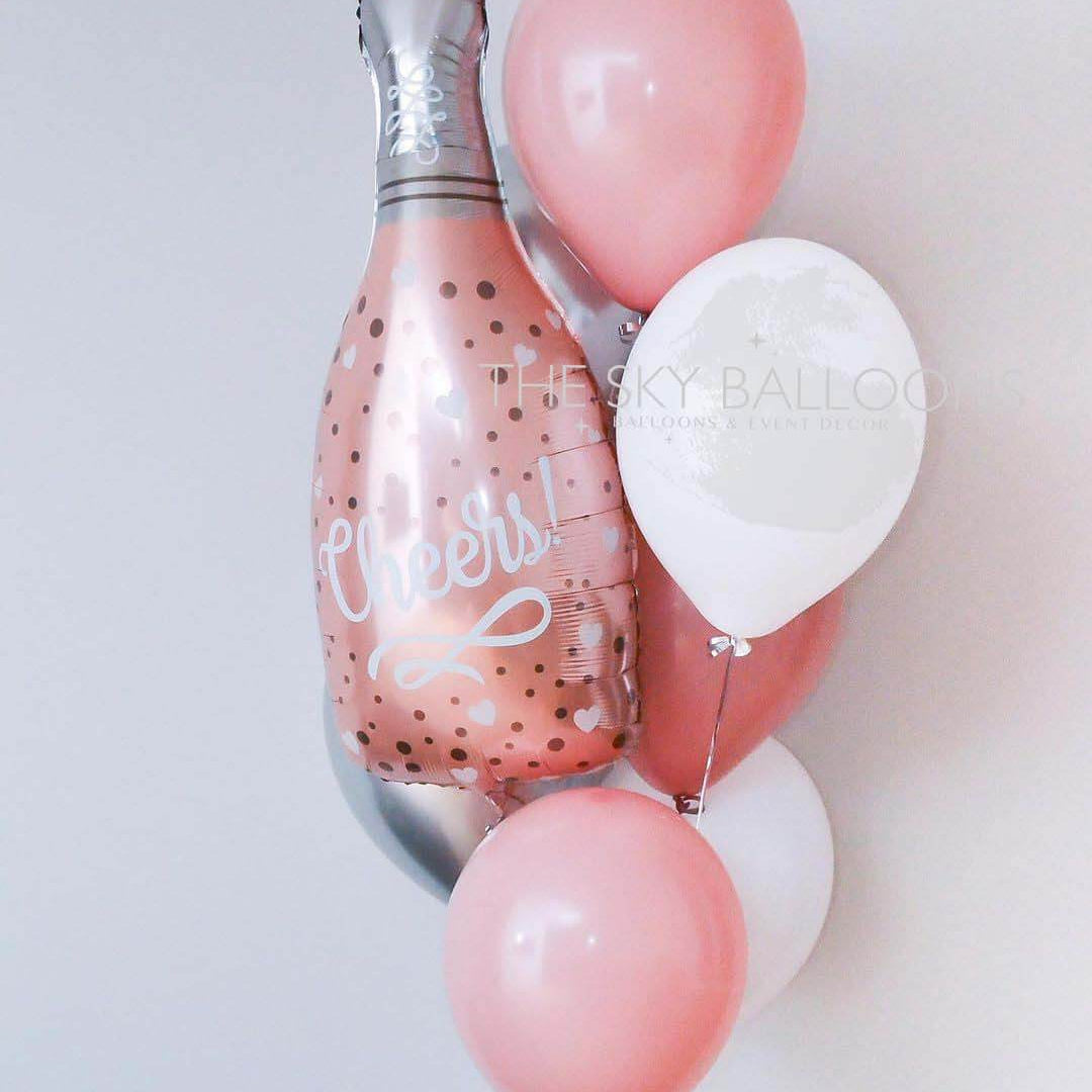 Colorful balloons arranged around a champagne bottle, perfect for celebrations and special occasions.