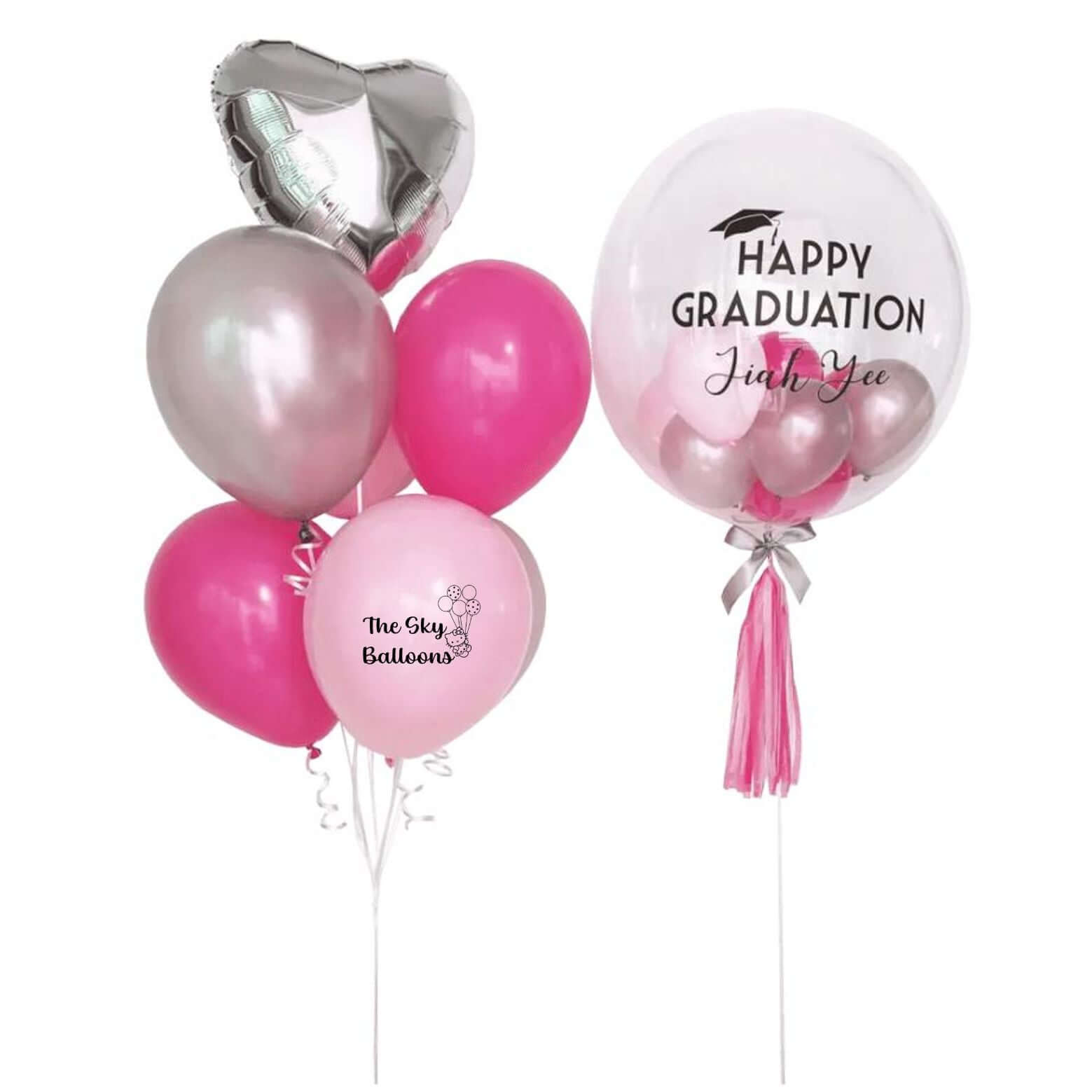 A set of pink and silver balloons with 'Happy Graduation' text and a heart-shaped balloon, all tied with ribbons.