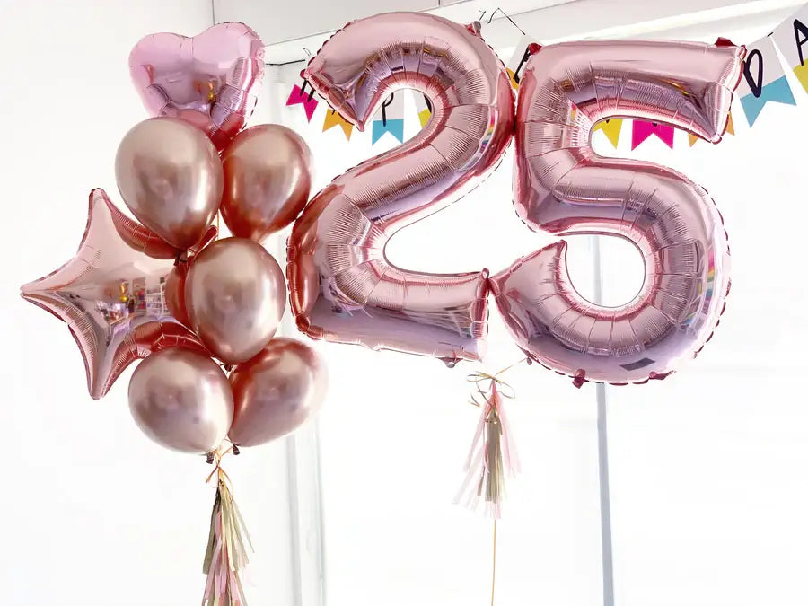 Rose gold balloons with number '25' for a 25th birthday celebration.