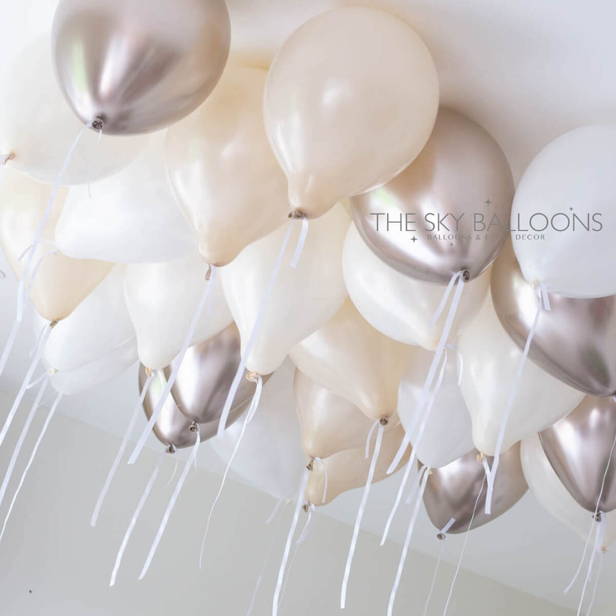 Premium balloon bouquet delivery setup in Arabian Ranches villa Dubai with rose gold and champagne decorations for family celebration