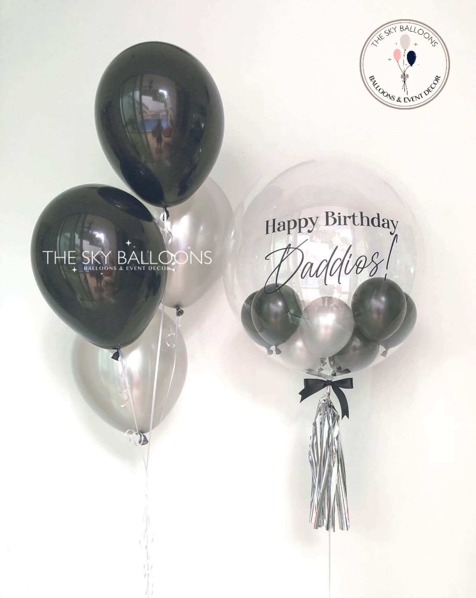 Customized birthday balloon bouquet with colorful confetti from The Sky Balloons.