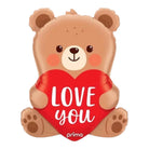 Teddy bear-shaped balloon with a red heart and 'LOVE YOU' text, featuring the brand 'prima'.