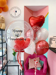 Happy 1st anniversary balloon bouquet: a colorful arrangement of balloons celebrating a year of love and happiness.