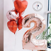 Number two balloon with heart shape, red and silver balloons, perfect for second birthday celebration.