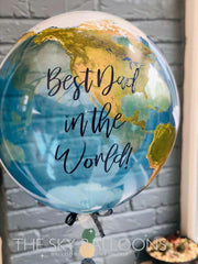 Bright balloon declaring "best dad in the world" flying gracefully in the air, a thoughtful gift idea.