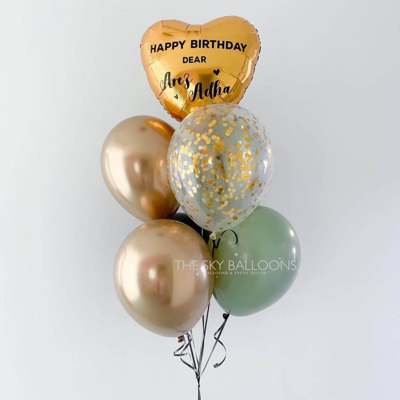 Bouquet of balloons including a heart-shaped 'Happy Birthday' balloon on a white background.