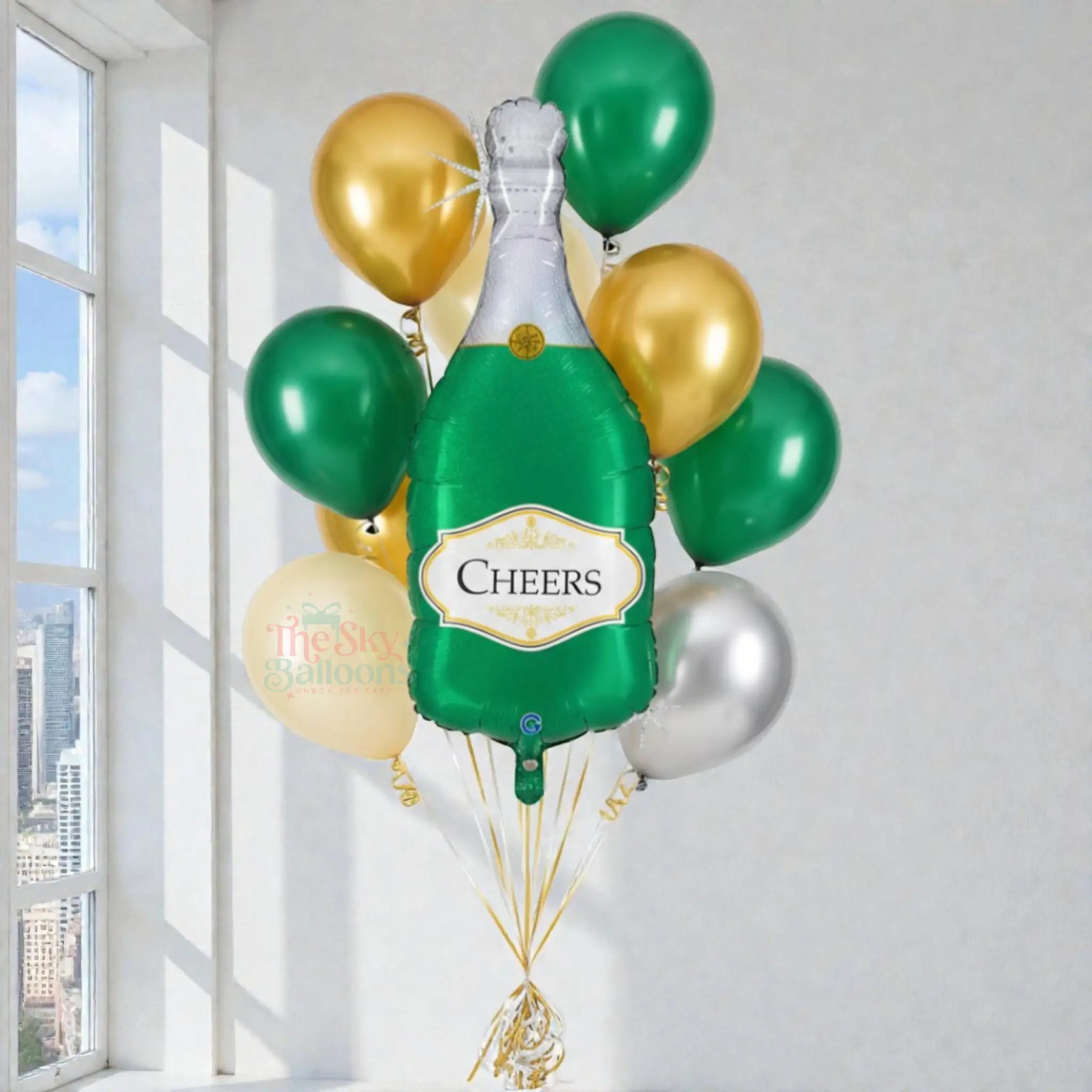 Bouquet of balloons shaped like a champagne bottle with 'Cheers' text, against a light background.