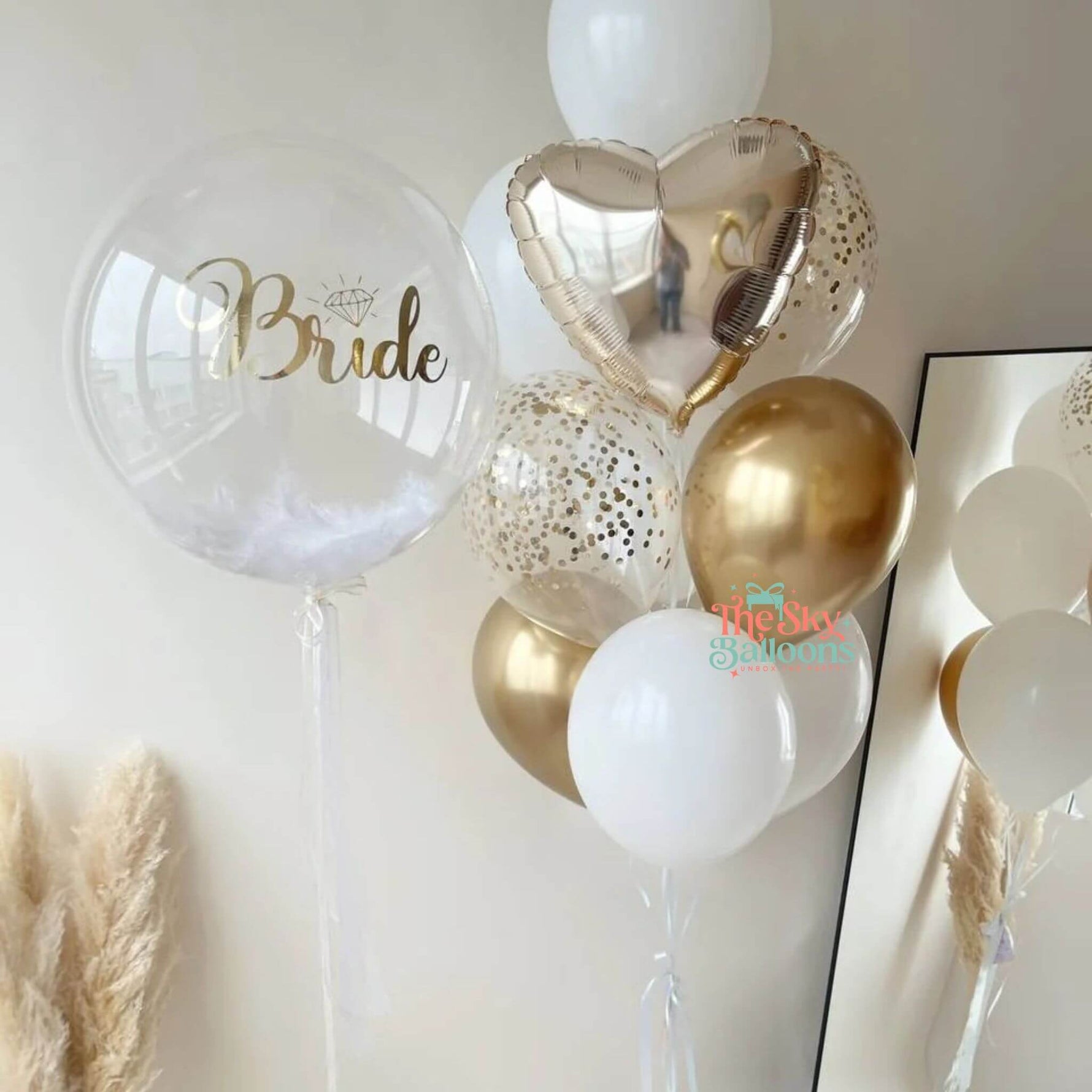 Decorative balloons with 'Bride' on a white wall