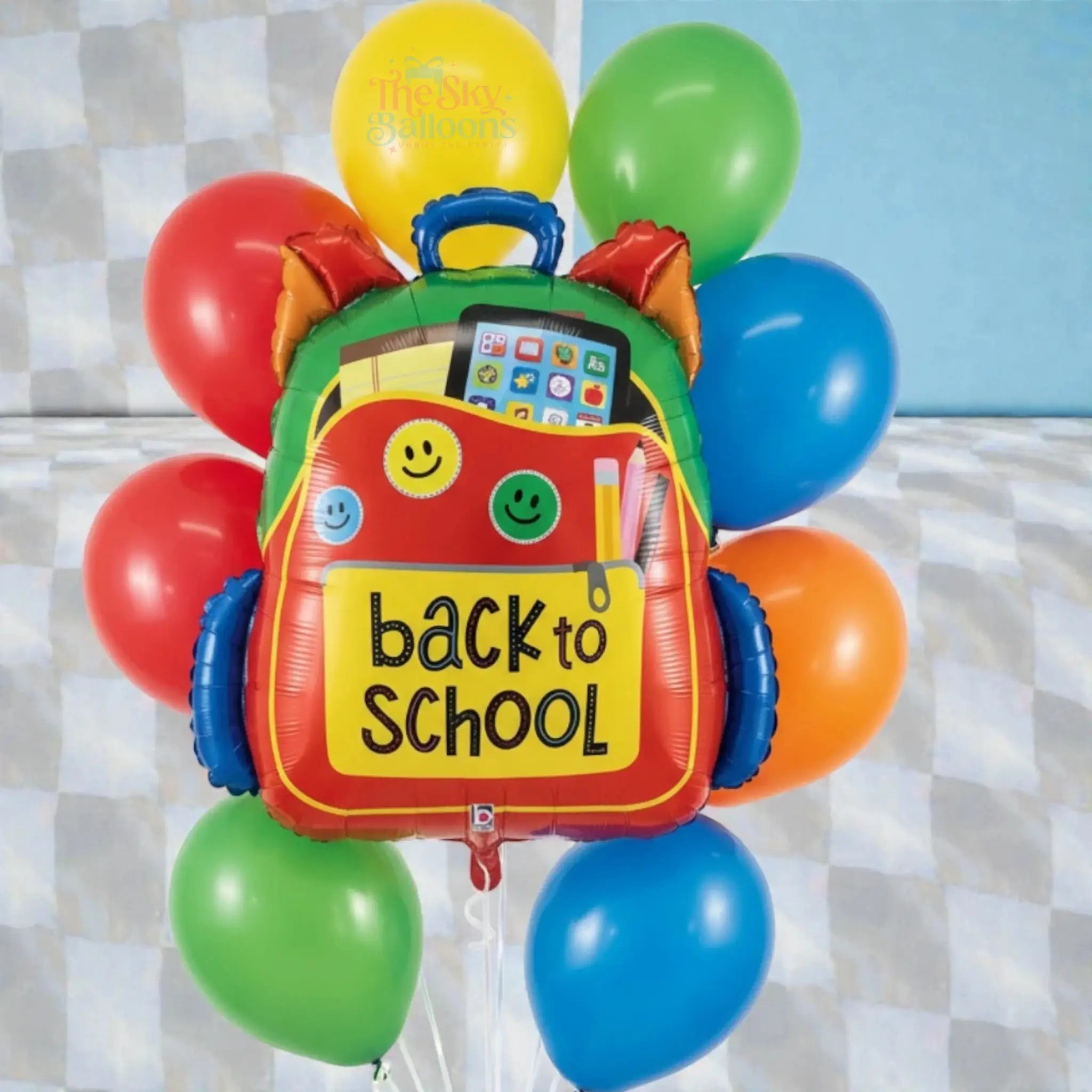 Colorful 'back to school' balloon shaped like a backpack with balloons around it.