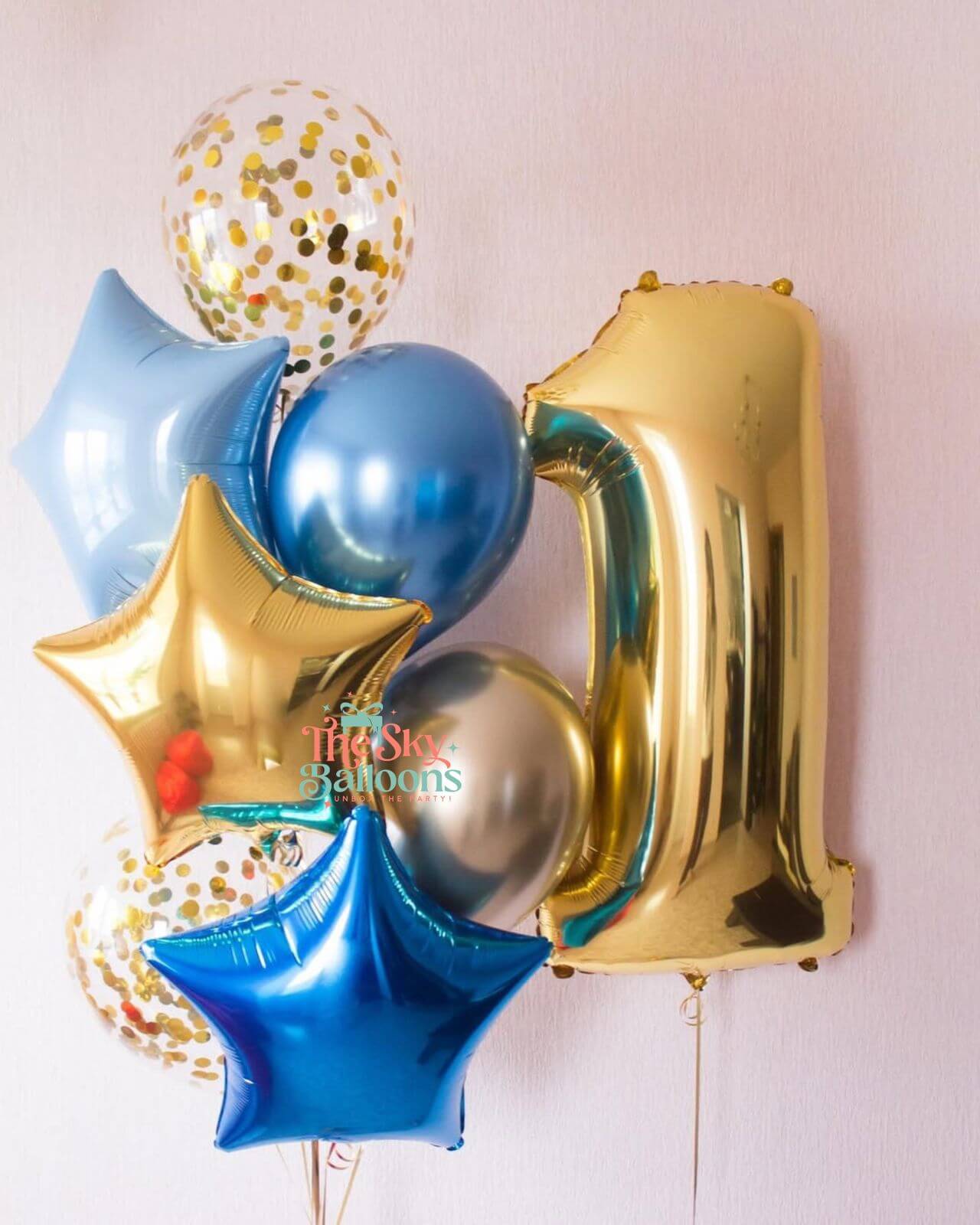 Colorful balloon set with number '21' and star shapes on a light pink background.