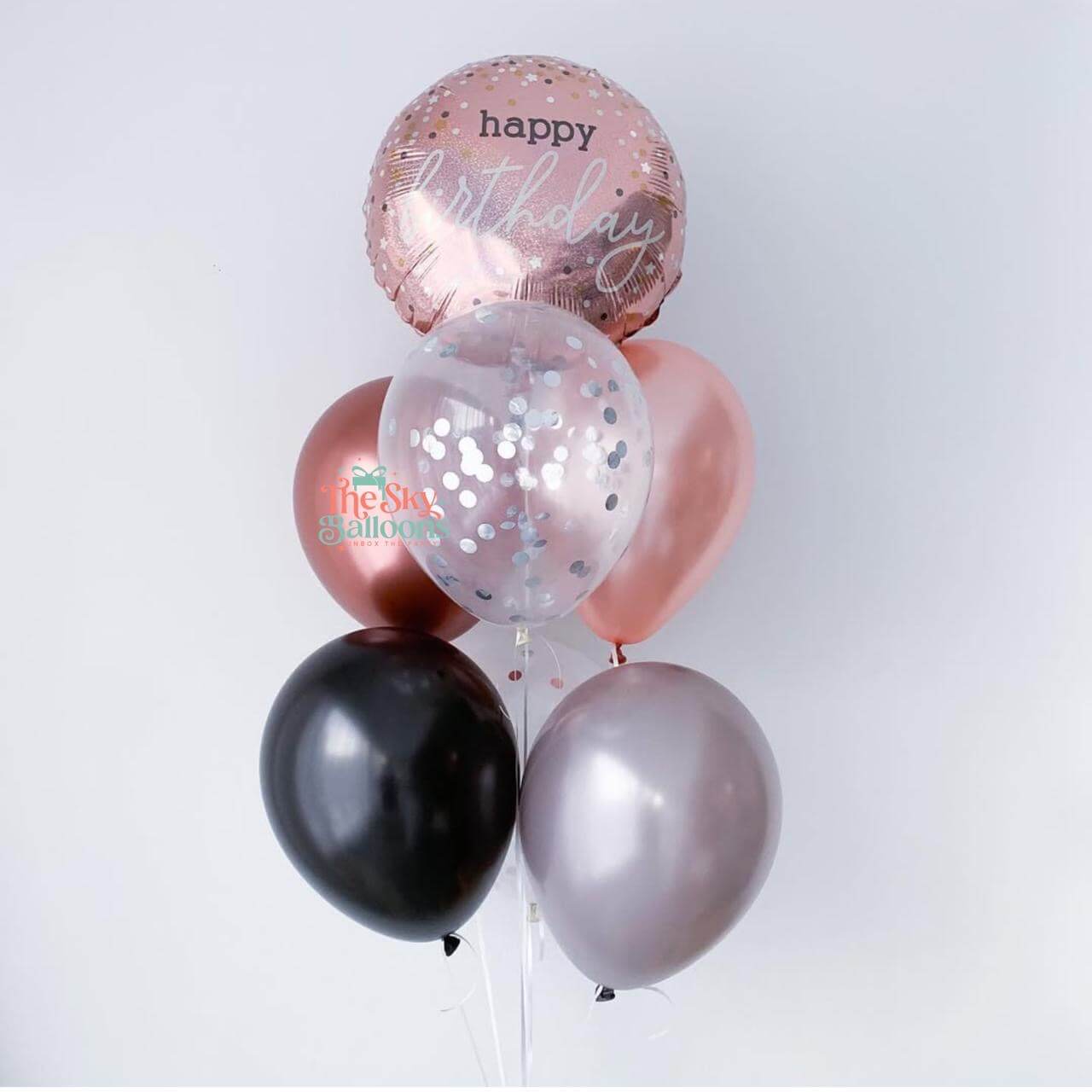 Bouquet of balloons including a 'happy birthday' balloon on a white background