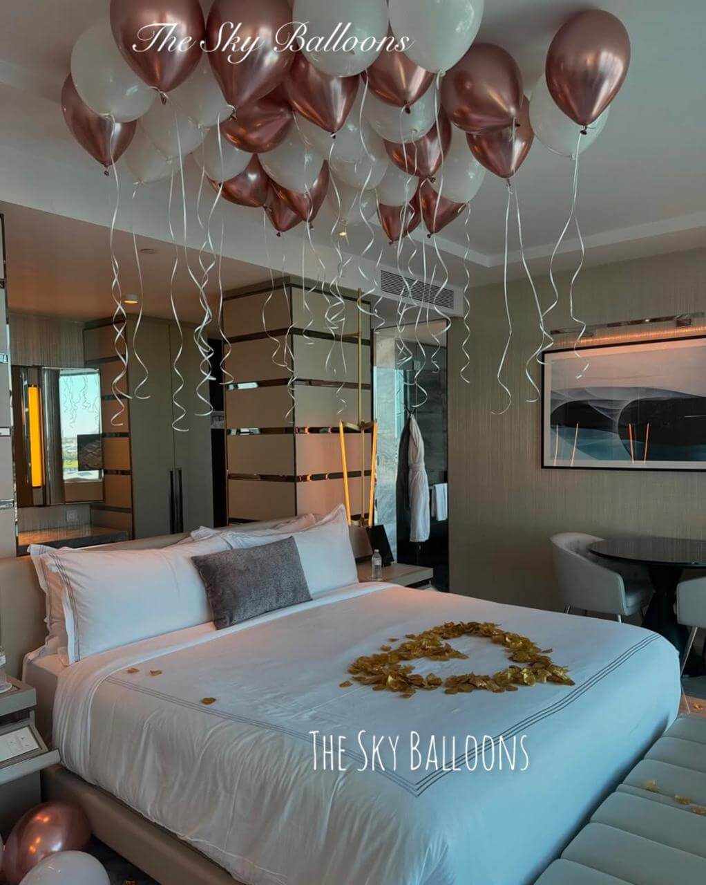 Decorative balloons in a bedroom setting with 'The Sky Balloons' branding.