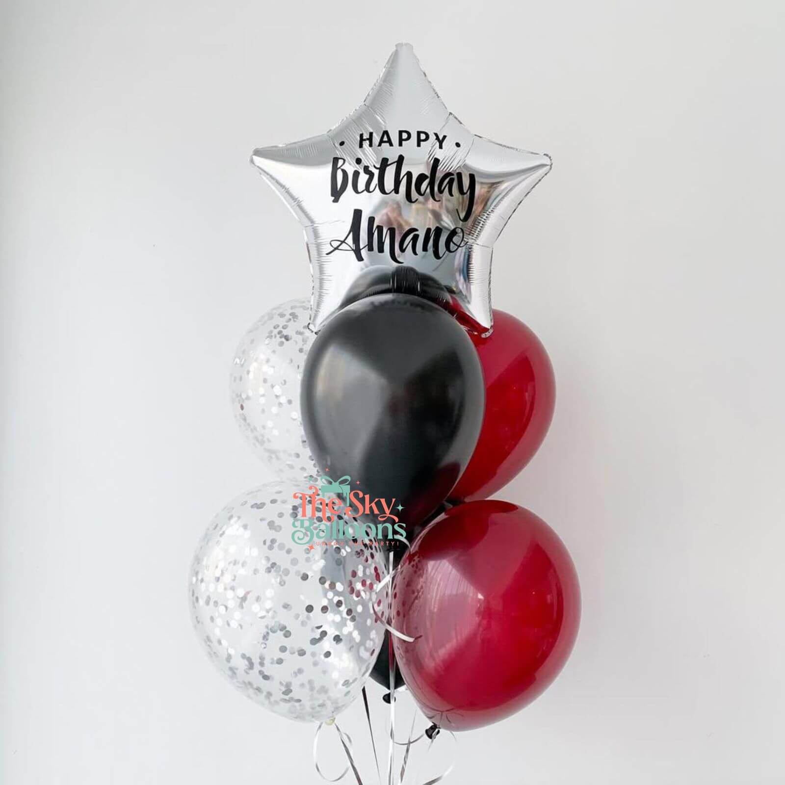 Balloon bouquet with 'Happy Birthday Alana' message on a white background