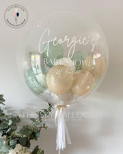 A personalized clear bubble balloon with a tassel, perfect for adding a touch of uniqueness to any celebration.