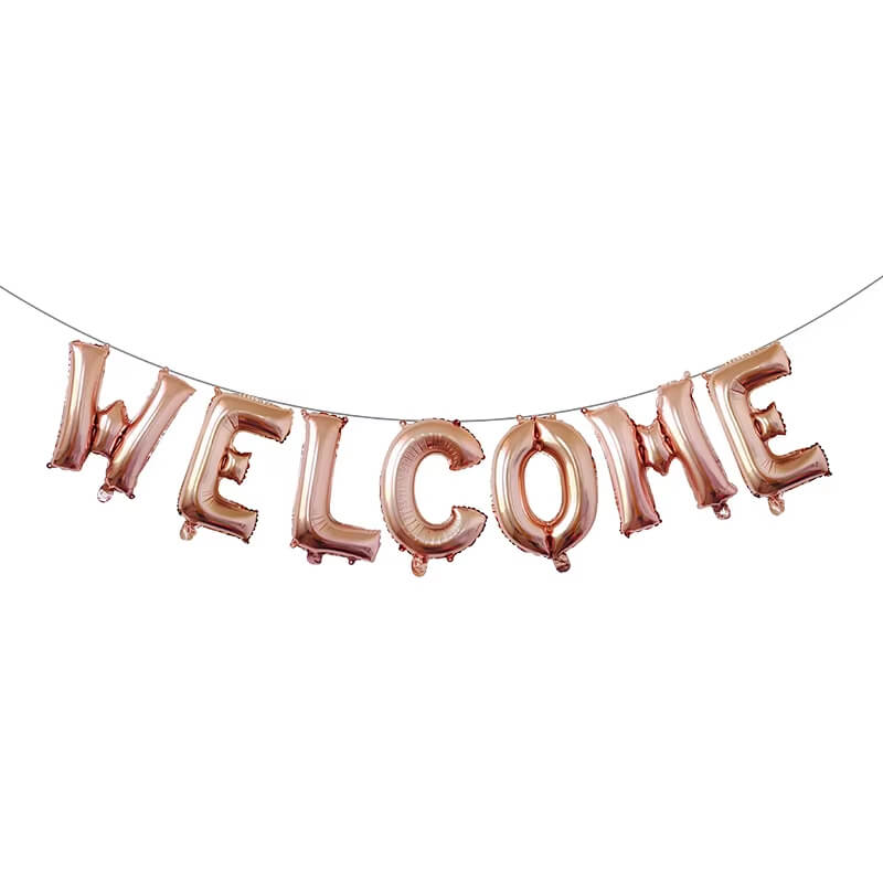 Rose gold 'WELCOME' balloon banner on a white background