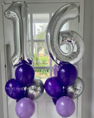 Silver number balloons spelling '16' with purple and gray balloons against a window background.
