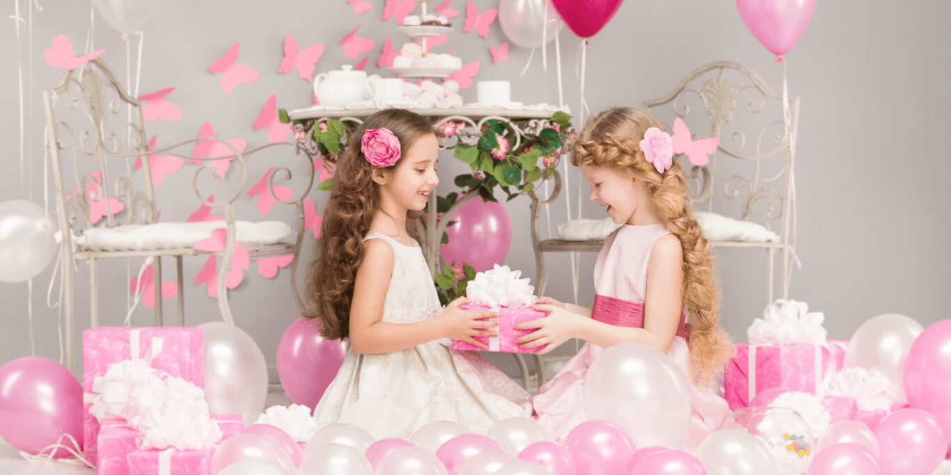 files/Two_young_girls_in_white_dresses_with_pink_pearl_pink_balloons.jpg