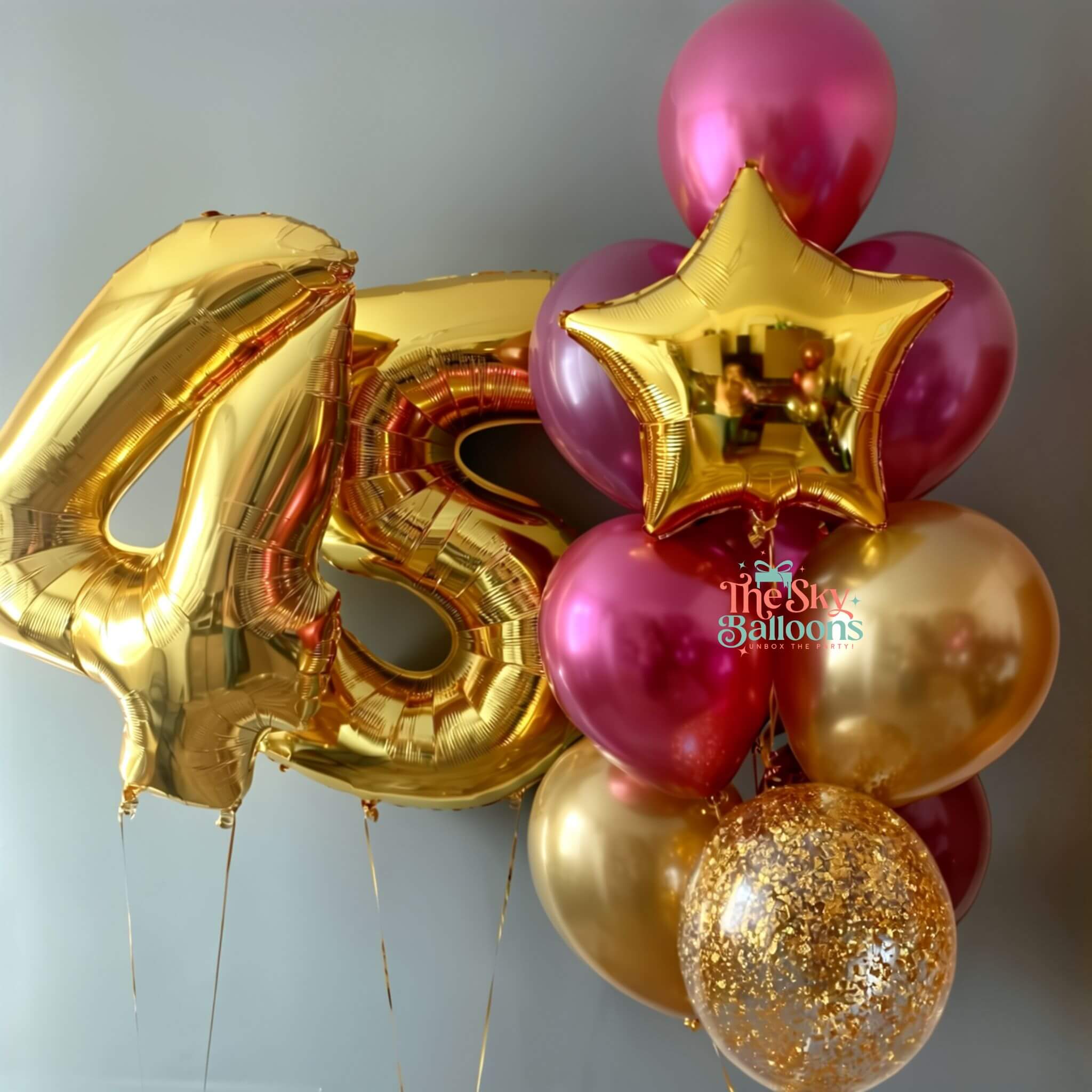 Gold and pink balloons with a number 45 and star shape, featuring 'The Star Balloons' brand.
