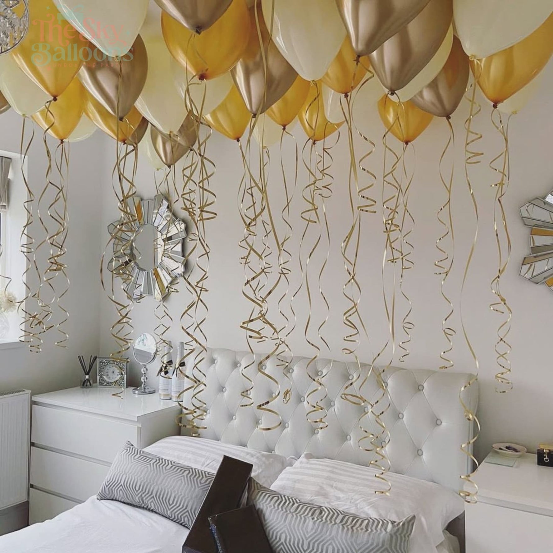 Decorative balloons and streamers in a bedroom setting