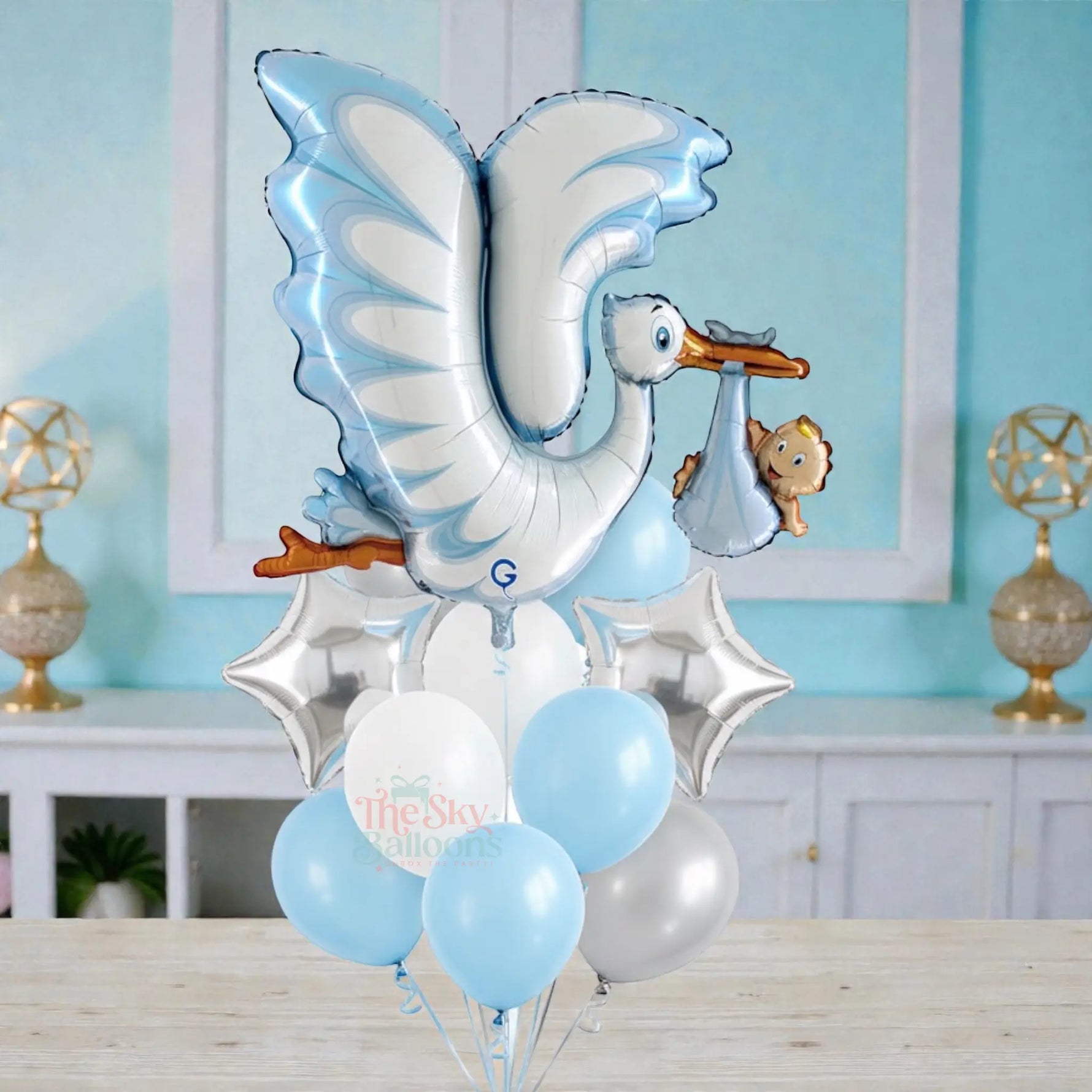 Balloon bouquet with stork and baby design on a white background