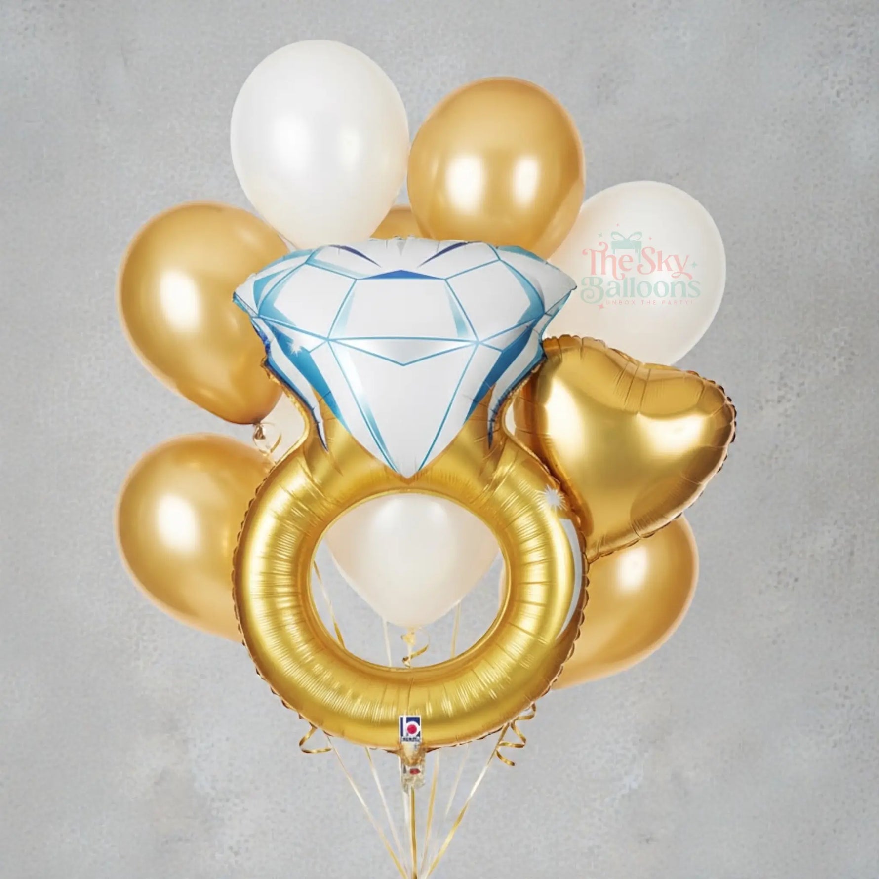 Bouquet of balloons with a diamond ring and heart shapes on a white background