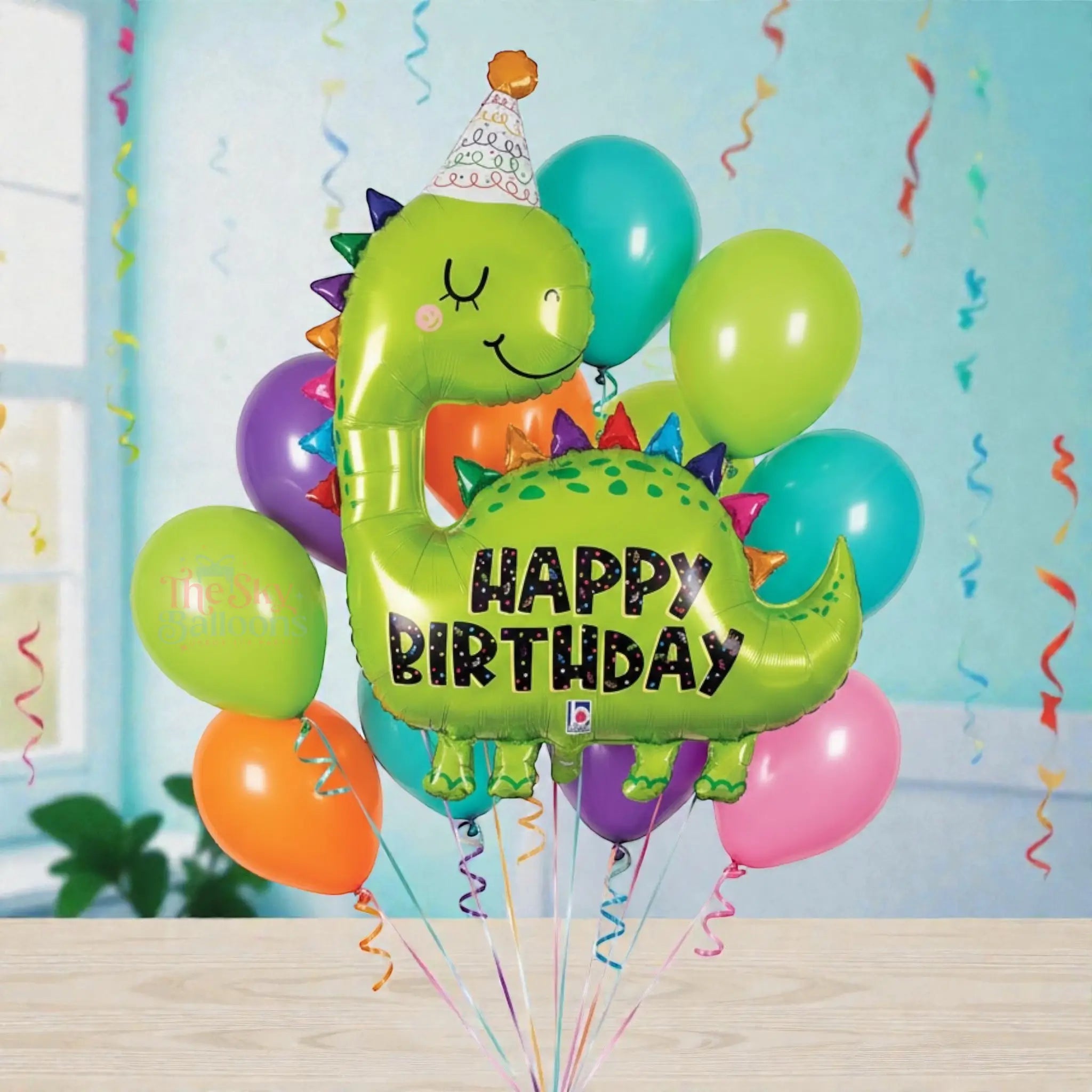 Colorful balloon bouquet with a dinosaur-shaped balloon saying 'Happy Birthday' on a white background