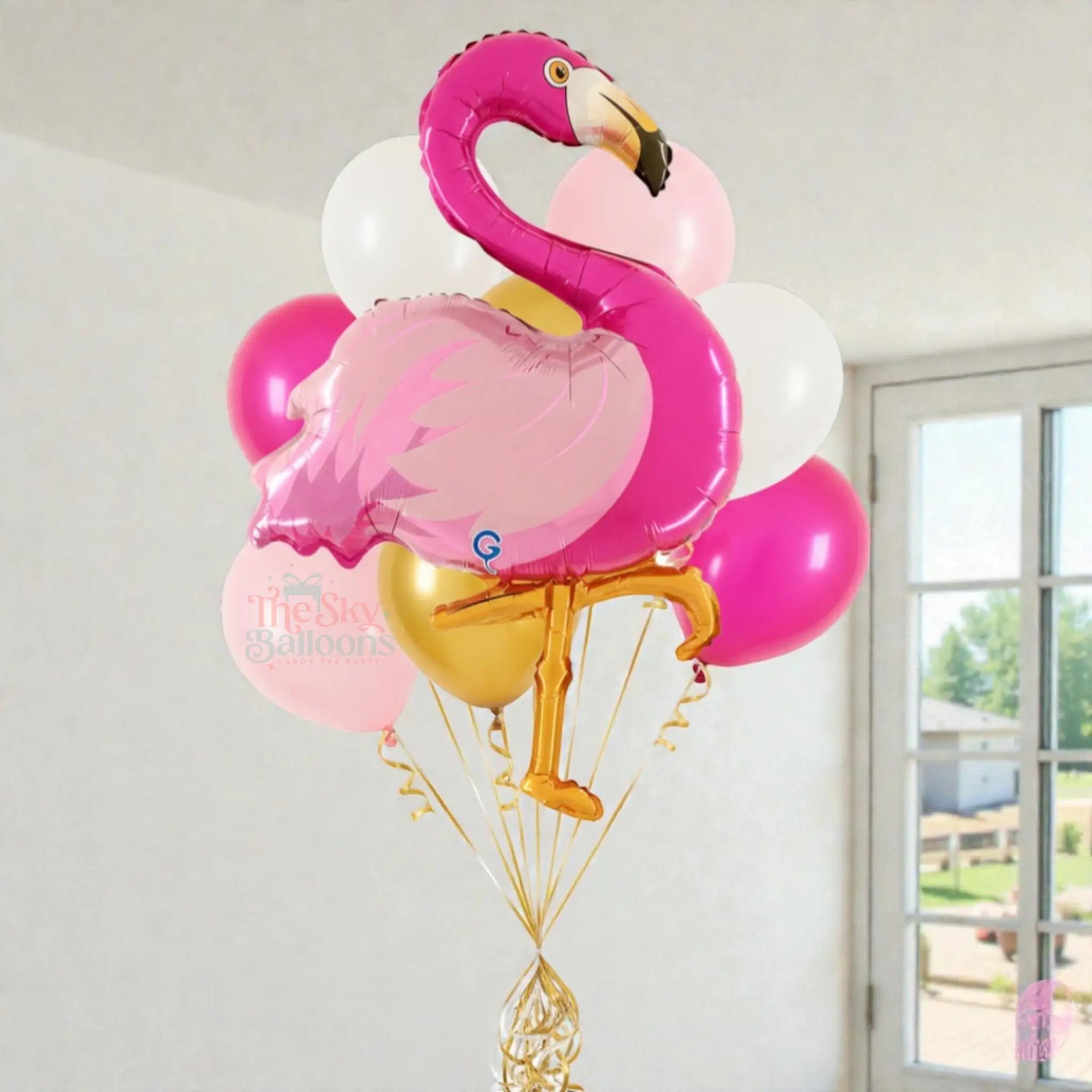 Flamingo-shaped balloon with other balloons against a neutral background