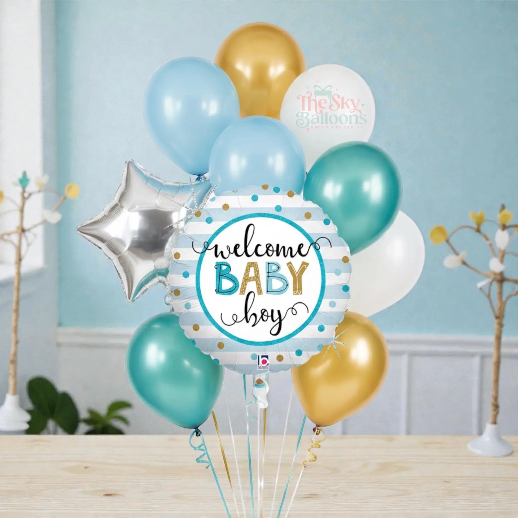 Balloon bouquet with 'Welcome Baby Boy' balloon on a white background