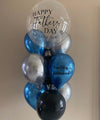 Colorful balloon bouquet with "Happy Father's Day" message, perfect gift to celebrate dad's special day.